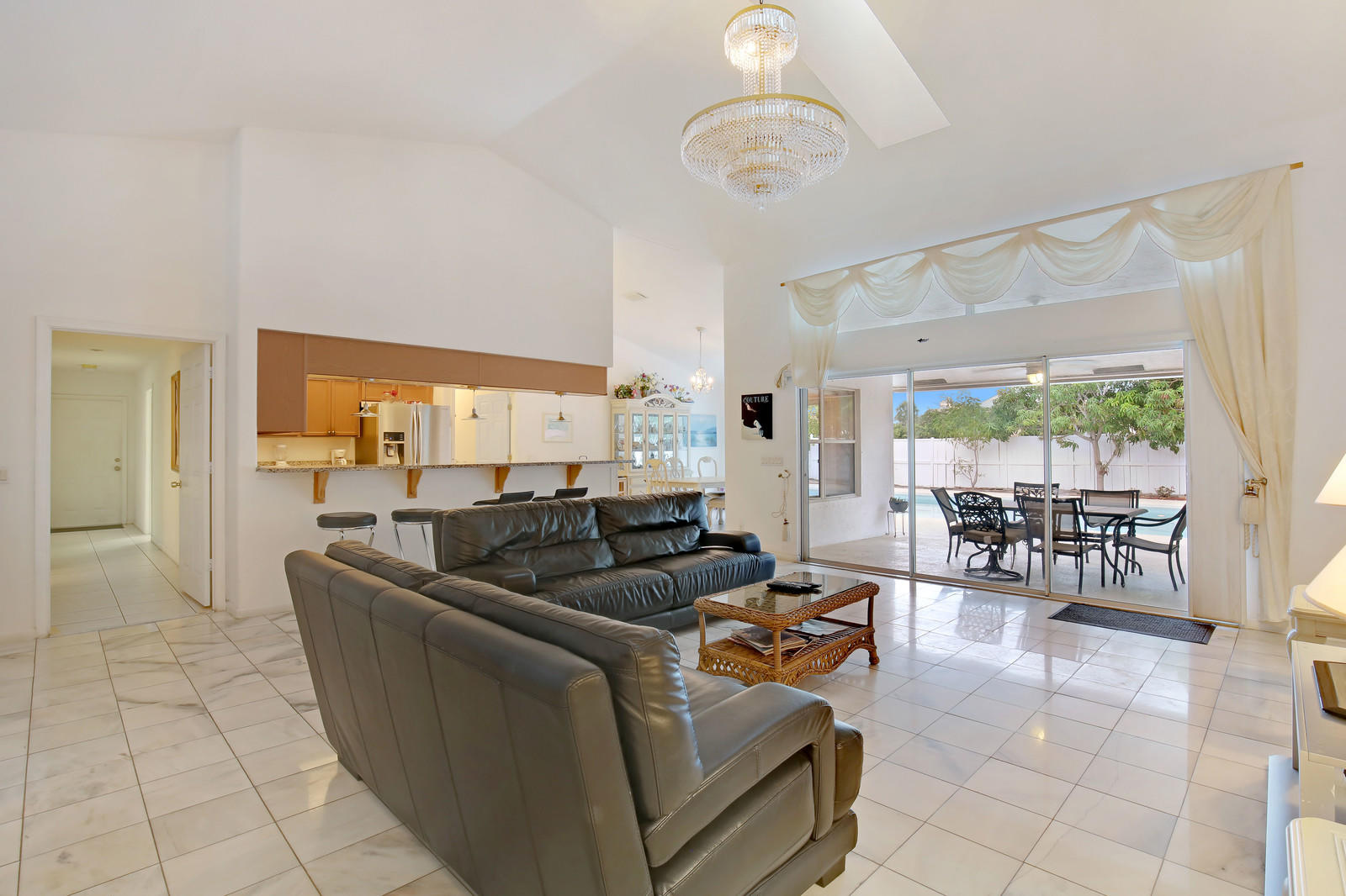 299 Palm Avenue Jupiter, FL 33477 - Photo 7 of 26 a living room with furniture and a large window