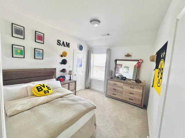 a bedroom with furniture and a bed