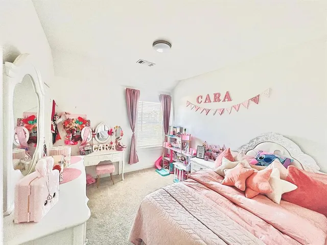 a bed room with a bed and a couch