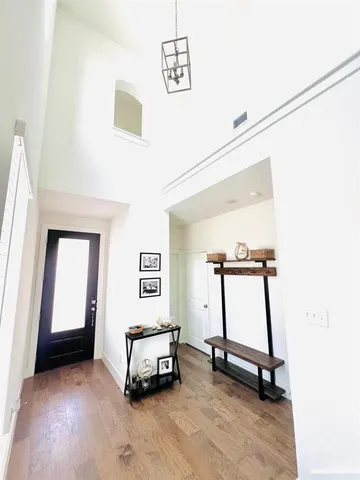 a living room with a table and gym equipment