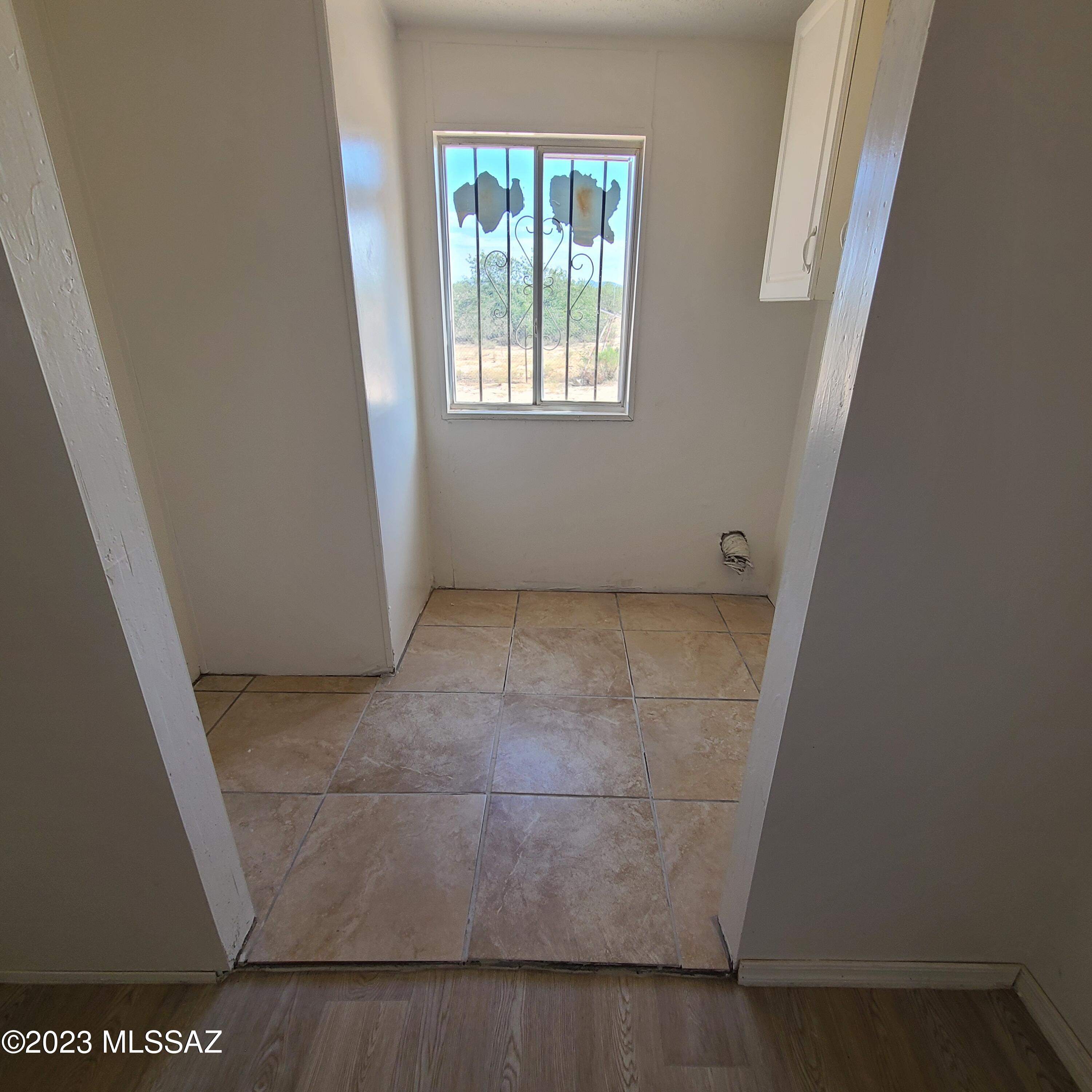8896 South Marstellar Road Tucson, AZ 85736 - Photo 30 of 39 a view of an empty room with a window