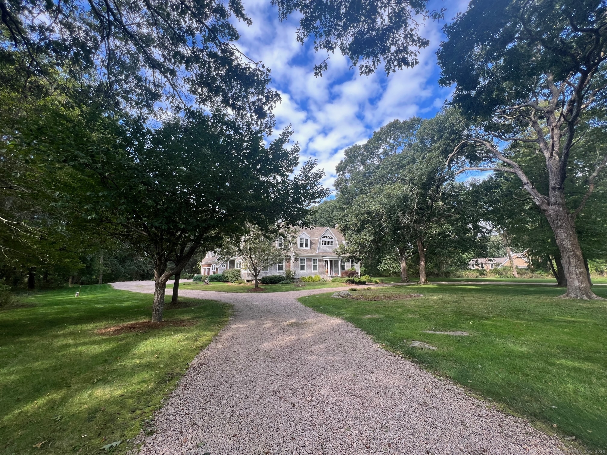Beautiful Pastoral Setting with Circular Drive nestled on 2.94 Acres.