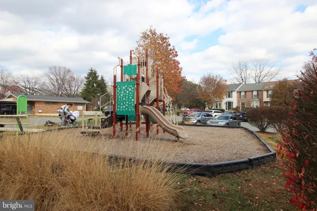 a view of a swimming pool and trees in the background