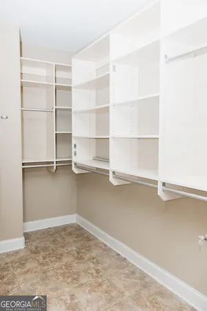 a view of an empty room with empty racks