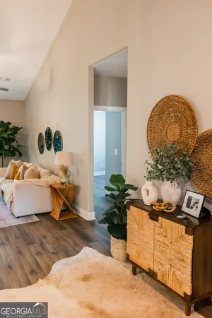 a living room with furniture and a potted plant