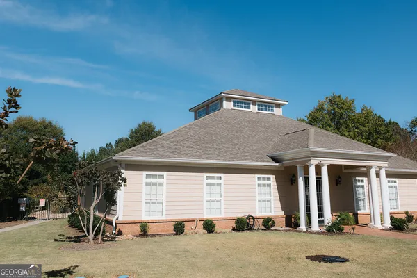 a front view of a house with a yard