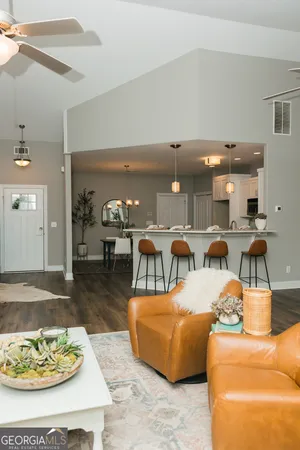a living room with furniture and a table