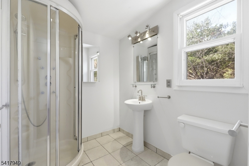 10 Minnehaha Path Lincoln Park, NJ 07035 - Photo 18 of 32 a bathroom with a sink toilet and shower