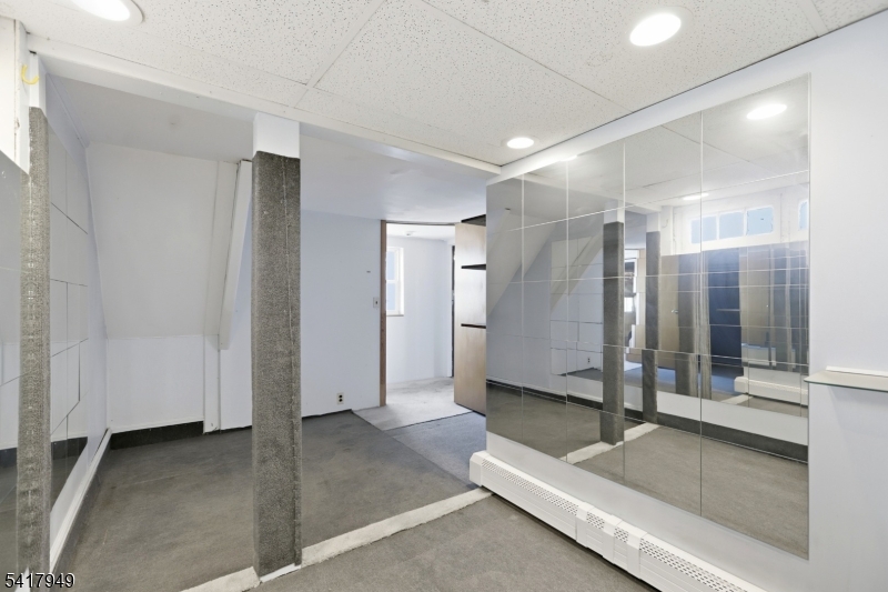 10 Minnehaha Path Lincoln Park, NJ 07035 - Photo 22 of 32 a spacious bathroom with a glass shower door and a bathtub