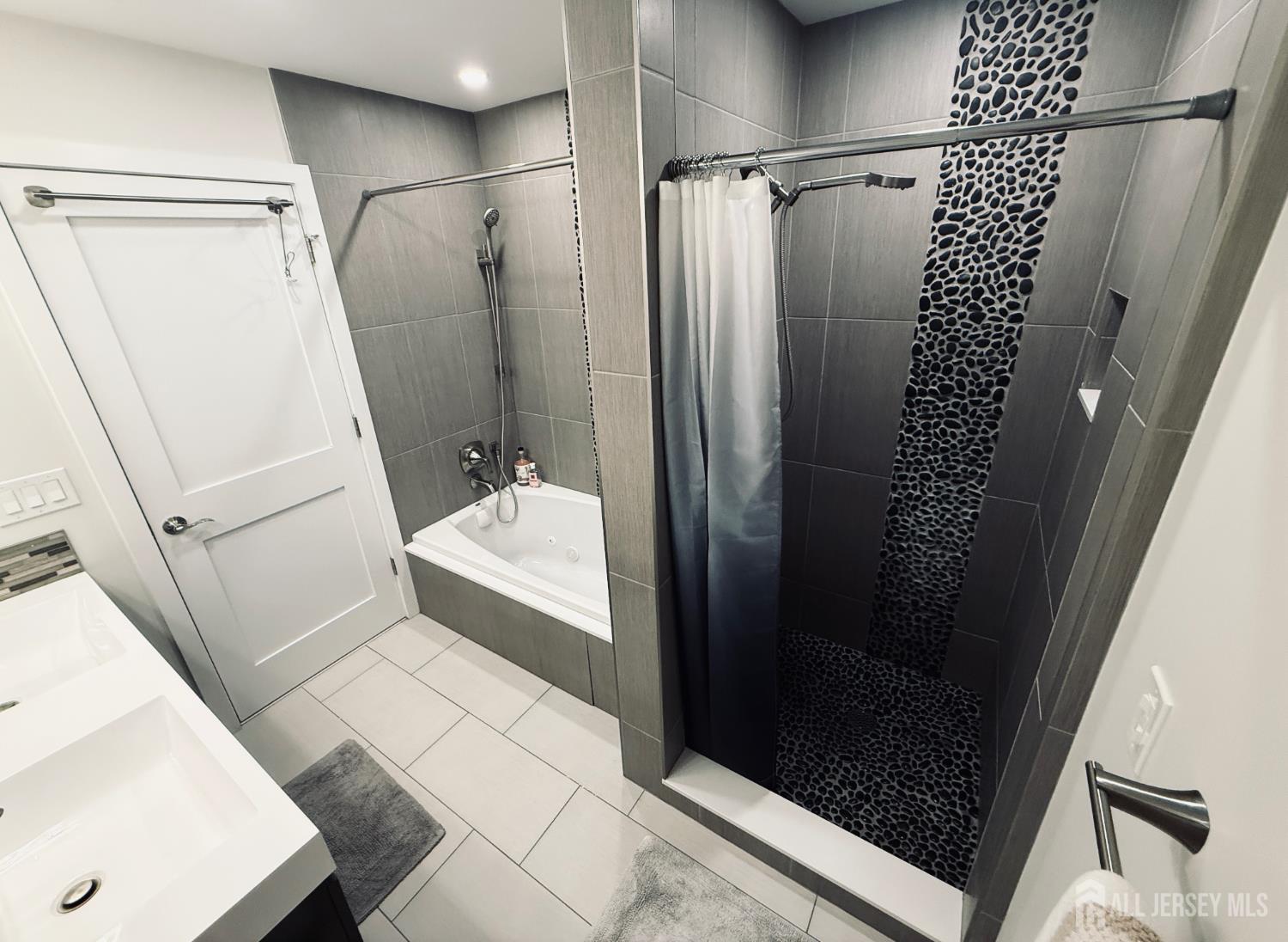 566 Ticetown Road Old Bridge, NJ 08857 - Photo 18 of 23 a bathroom with a shower and a sink