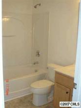 1911 Sandal Brook Road, Unit 115 Fort Mill, SC 29707 - Photo 4 of 4 a bathroom with a toilet and a bath tub