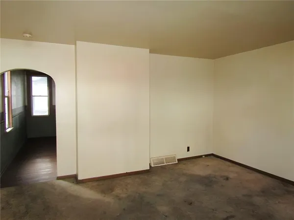 an empty room with windows