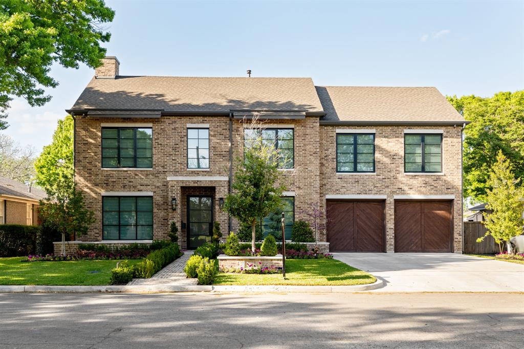 5019 Lark Lane Dallas, TX 75209 - Photo 1 of 32 a view of a brick house with a yard plants and large tree