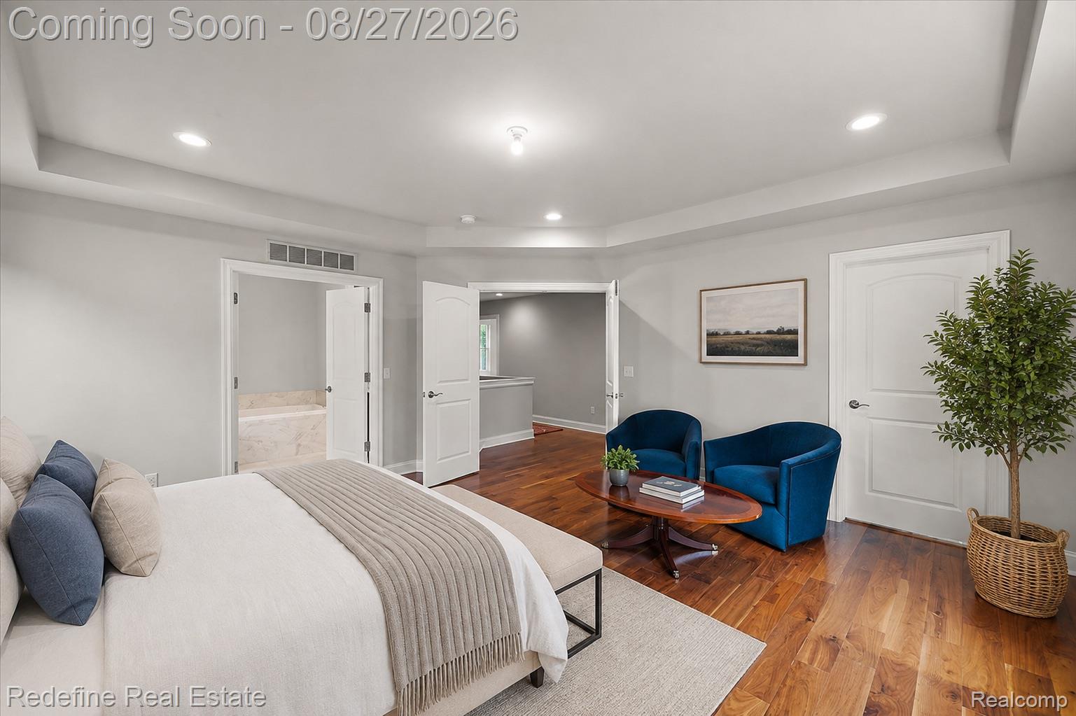 149 Woodward Avenue Rochester, MI 48307 - Photo 18 of 51 Hardwood-finish flooring, recessed lighting, tray ceiling, white paneled doors, and a built-in tub with tile surround