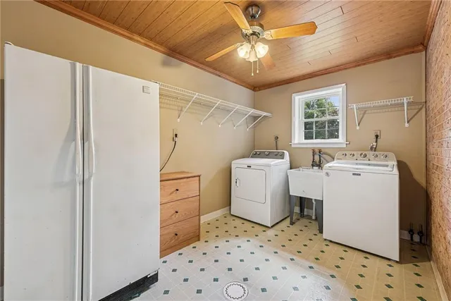 a view of a storage & utility room with dryer and washer