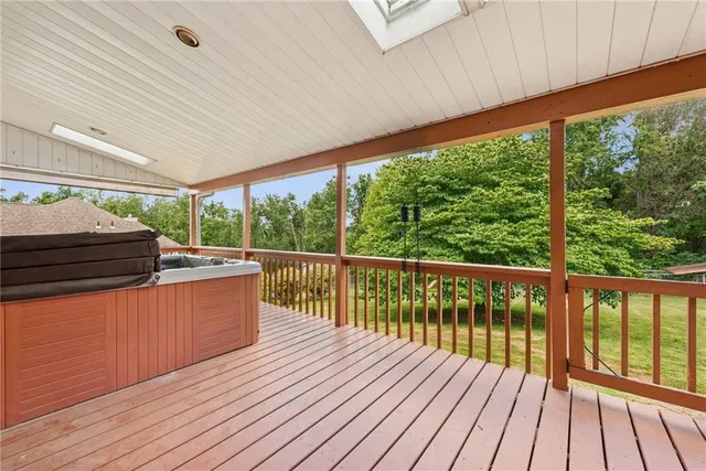 a view of a balcony with wooden floor
