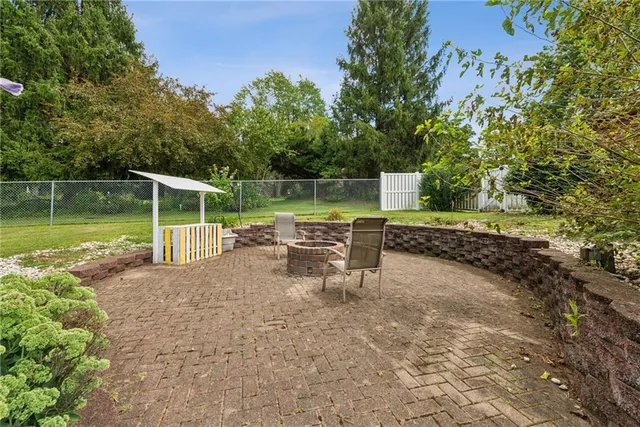 a view of a chair and table on the patio