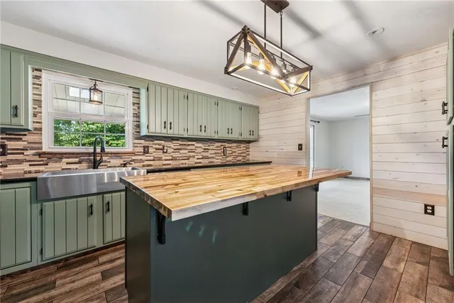 a kitchen with a sink and wooden cabinets