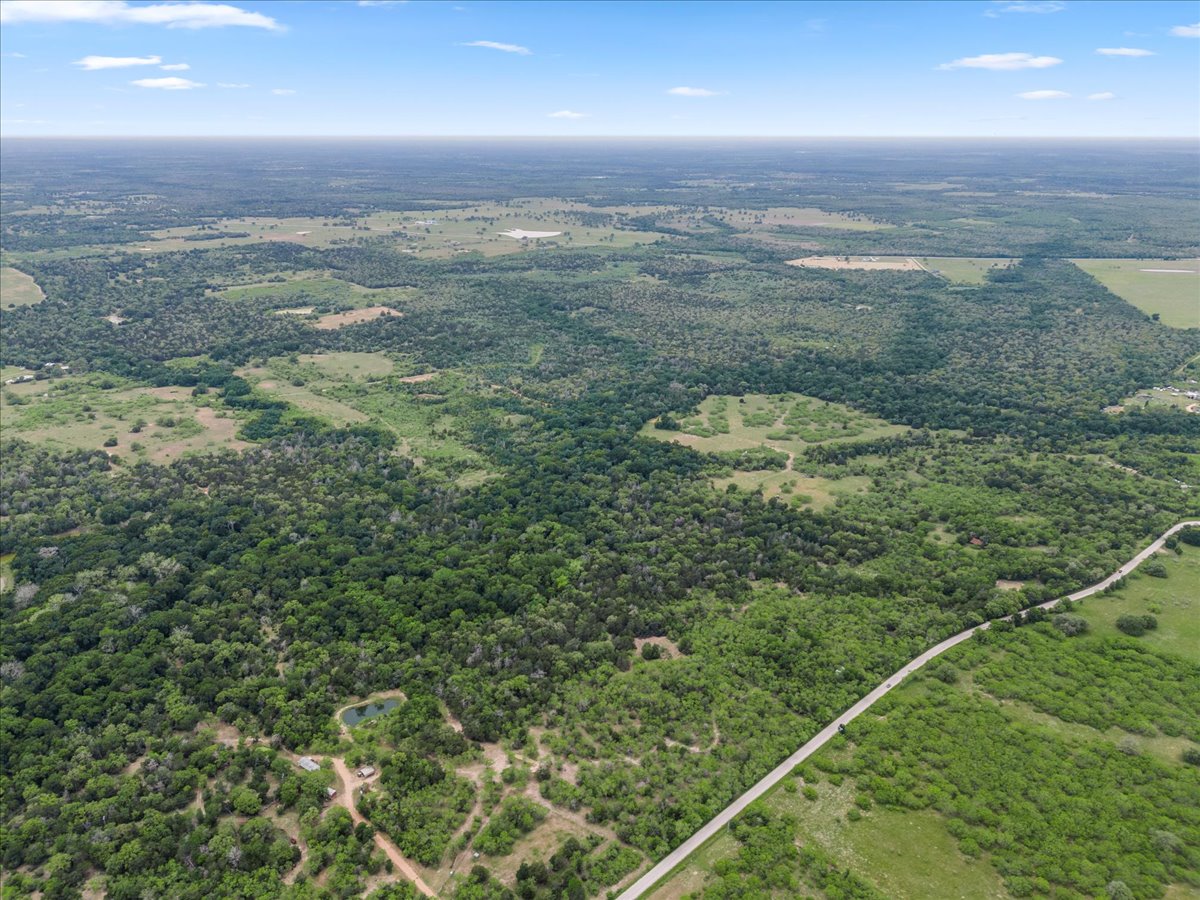 Tbd Anchor Ranch Loop Flatonia, TX 78941 - Photo 21 of 21 Bird's eye view featuring a wooded view