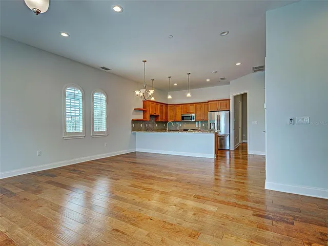 a kitchen with stainless steel appliances granite countertop a stove sink and cabinets