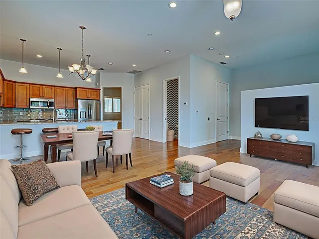 a view of a kitchen with a sink dishwasher microwave and cabinets