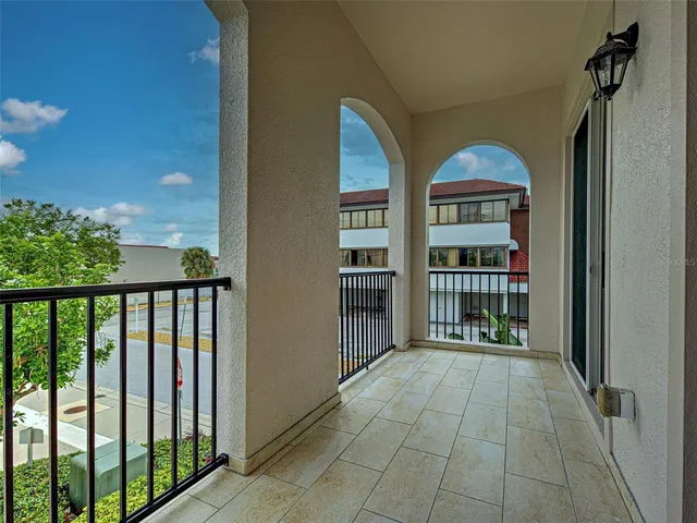 a bathroom with a granite countertop sink a toilet and a mirror