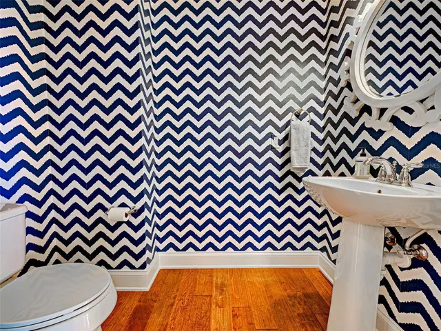 a spacious bathroom with a granite countertop sink mirror and shower