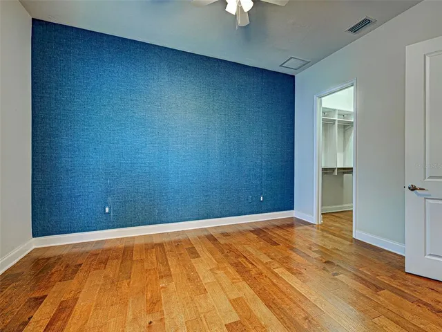 a view of an entryway with wooden floor and staircase