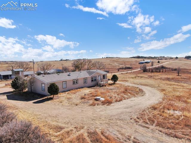 1010 Donald Road Colorado Springs, CO 80930 - Photo 30 of 32 Gravel drive wraps around the house for loading & unloading.