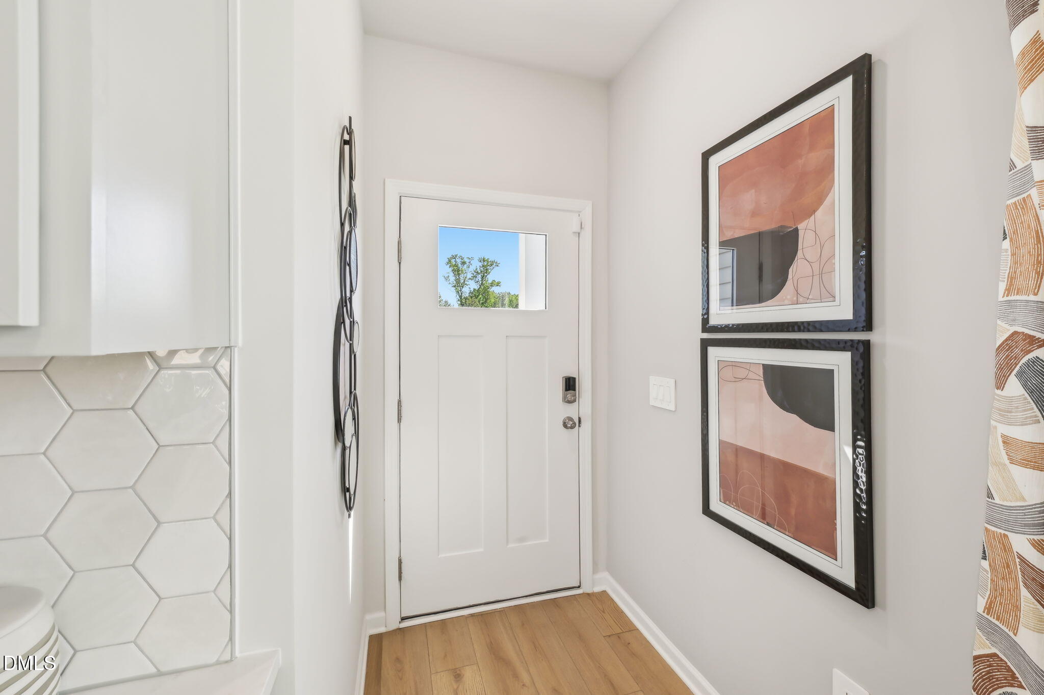 924 Broadleaf Trace Mebane, NC 27302 - Photo 5 of 26 a view of an entryway with wooden floor