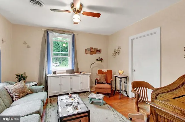 a living room with furniture and a window