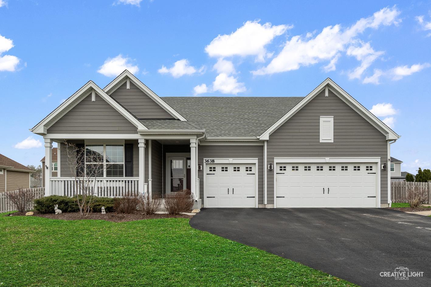 3638 Emerald Road Elgin, IL 60124 - Photo 1 of 18 a view of a house with a garden