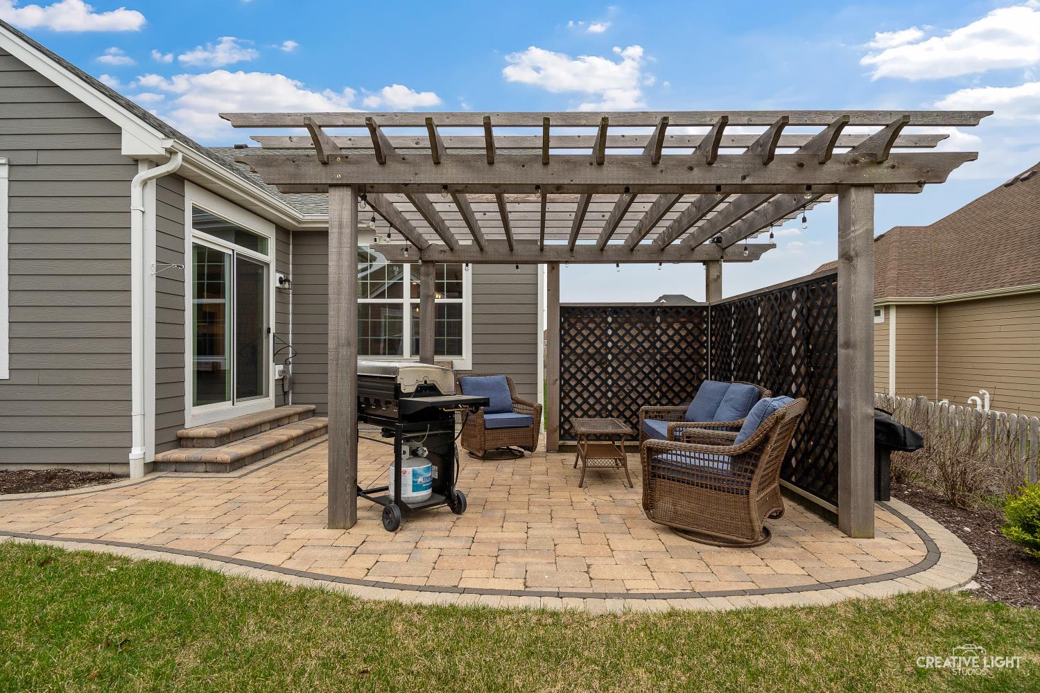 3638 Emerald Road Elgin, IL 60124 - Photo 17 of 18 a view of a patio with table and chairs with wooden floor and fence