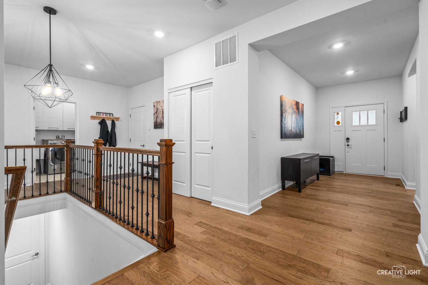 3638 Emerald Road Elgin, IL 60124 - Photo 2 of 18 a view of a hallway with a livingroom with furniture and window