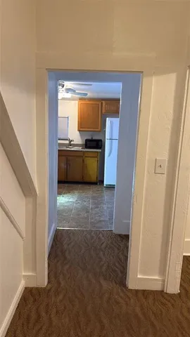 a view of utility room and front door