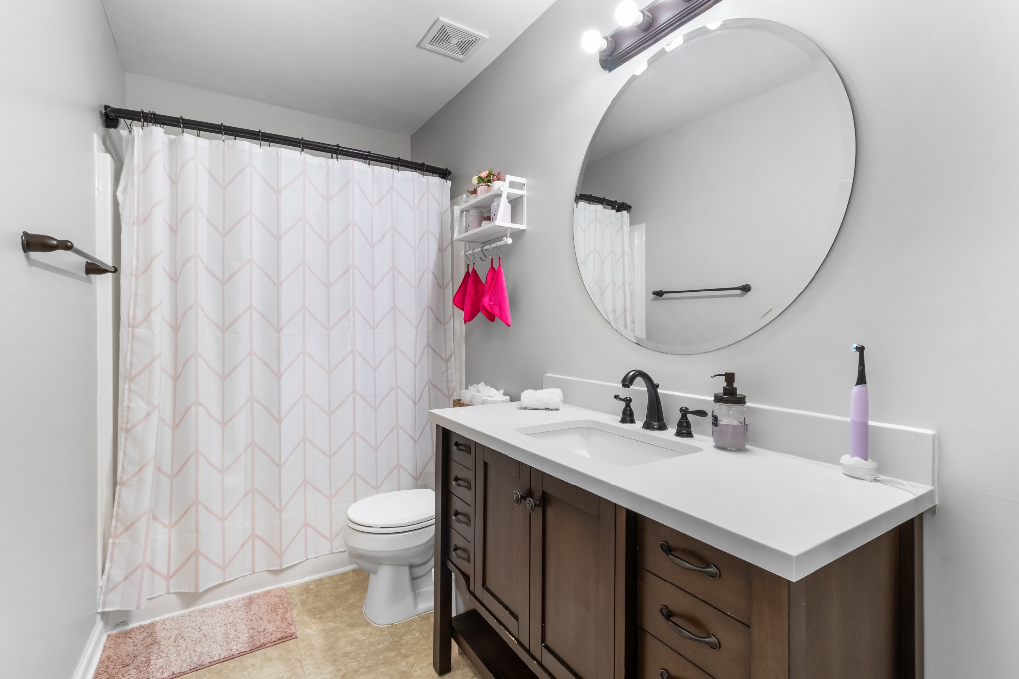 1069 Castlerock Drive Clarksville, TN 37042 - Photo 16 of 25 a bathroom with a sink vanity mirror and toilet