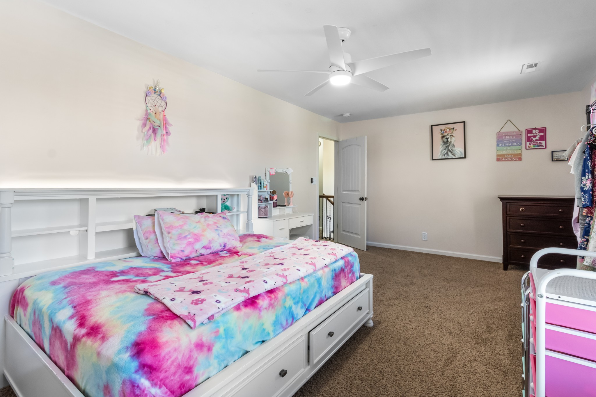 1069 Castlerock Drive Clarksville, TN 37042 - Photo 21 of 25 a bedroom with a bed and a chandelier