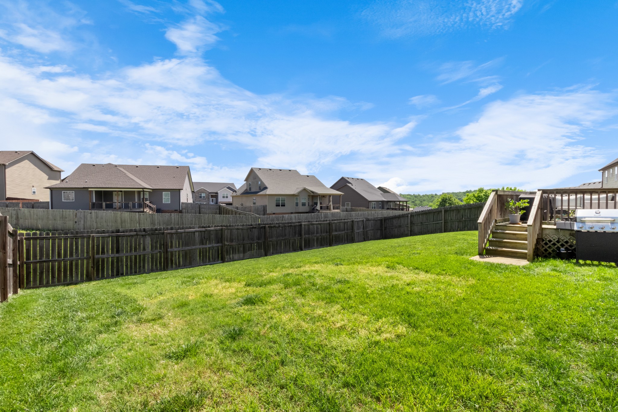 1069 Castlerock Drive Clarksville, TN 37042 - Photo 23 of 25 a view of a green field with wooden fence