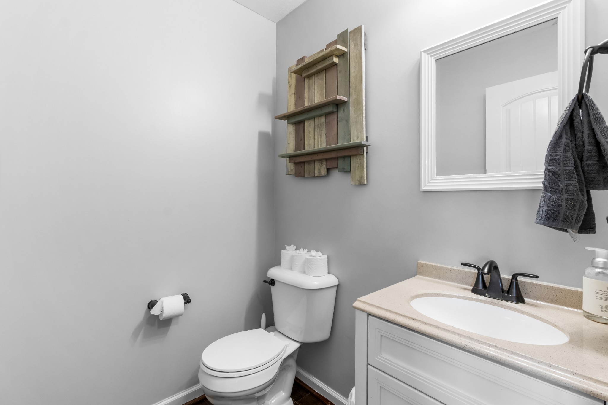1069 Castlerock Drive Clarksville, TN 37042 - Photo 5 of 25 a bathroom with a toilet a sink and mirror