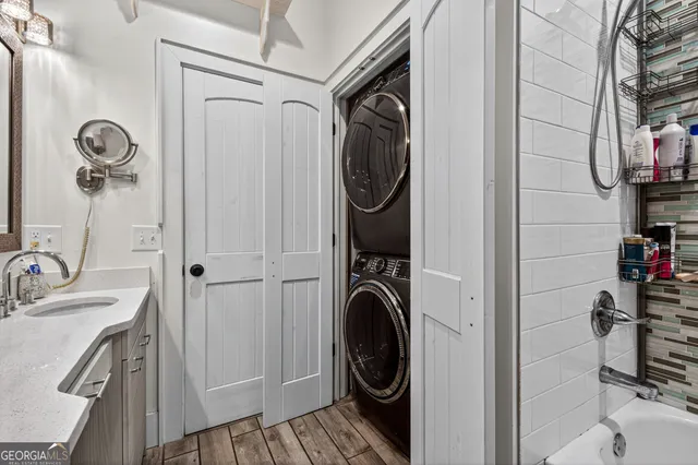 a view of a storage and utility room with a washer dryer