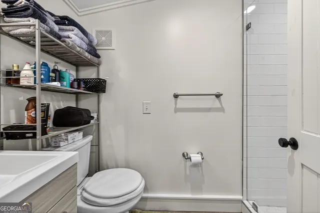 a bathroom with a toilet and a sink