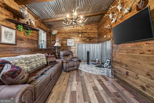 a bedroom with furniture and a chandelier