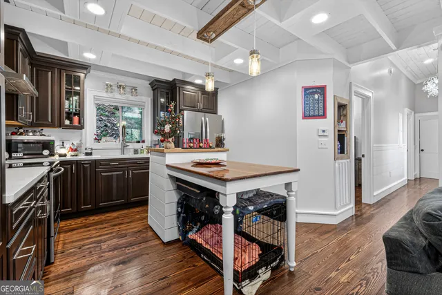 a kitchen with a stove and a refrigerator