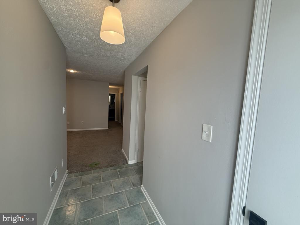 10050 Oakton Terrace Road Oakton, VA 22124 - Photo 3 of 28 Ceramic Foyer with Updated Lighting