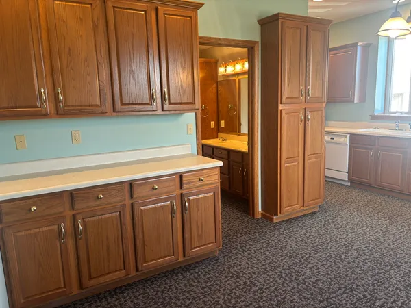 a kitchen with stainless steel appliances granite countertop a refrigerator and a stove