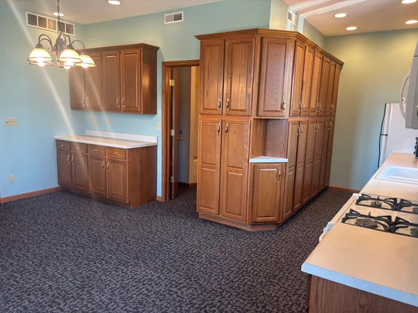 a view of an empty room with closet