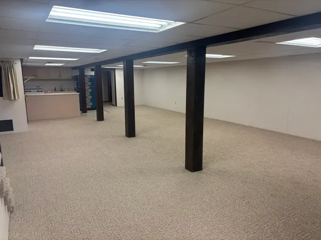 a kitchen with a refrigerator and a stove