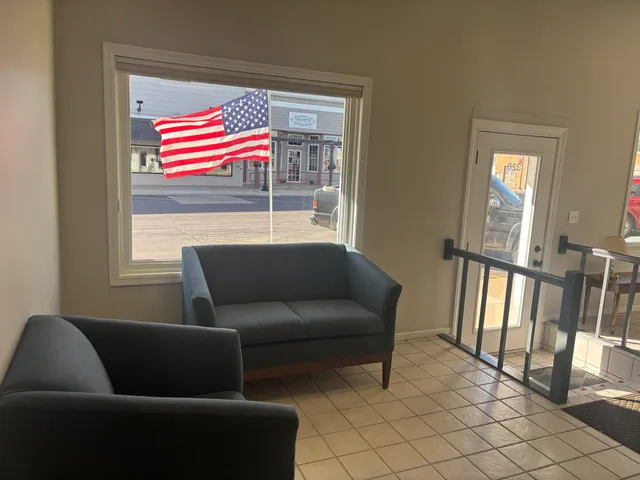 a living room with furniture and a window