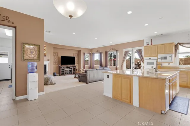 a bath tub sitting in a living room next to a window