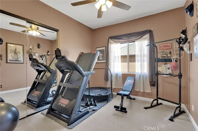 an aerial view of ocean and residential houses with outdoor space